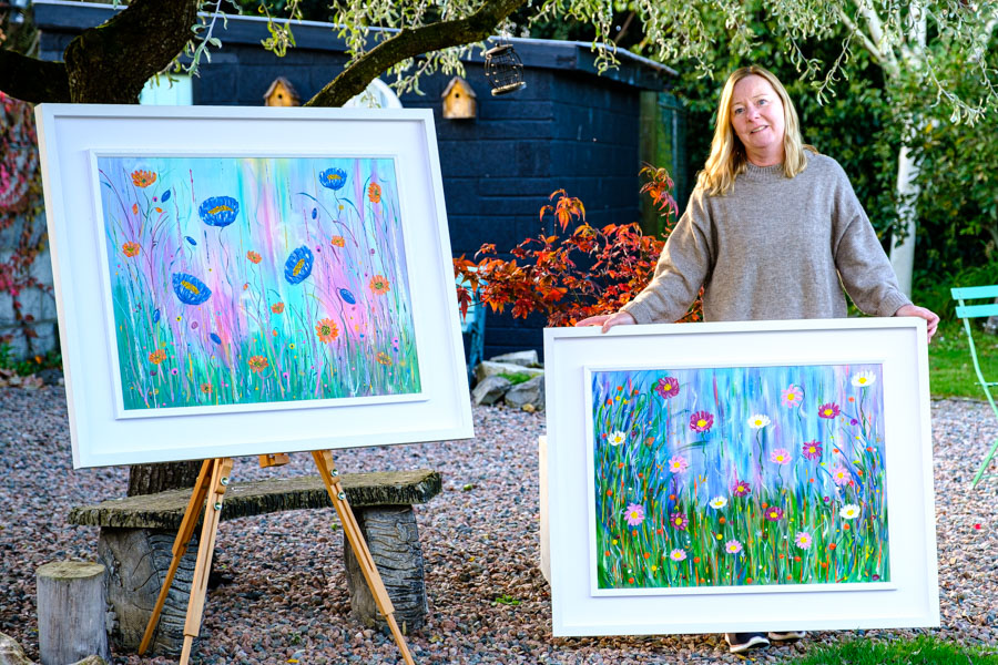 Lorraine O'Donovan with two of her latest paintings